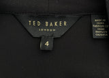 Black top with Ted Baker label on a gray background